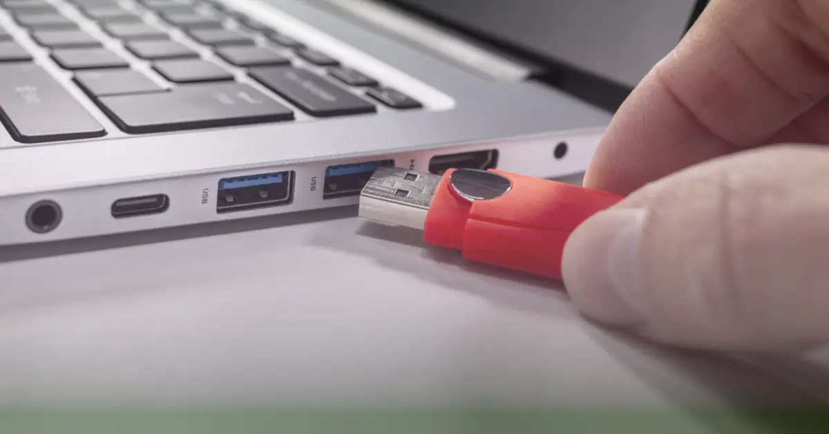 Plugging USB flash drive into laptop